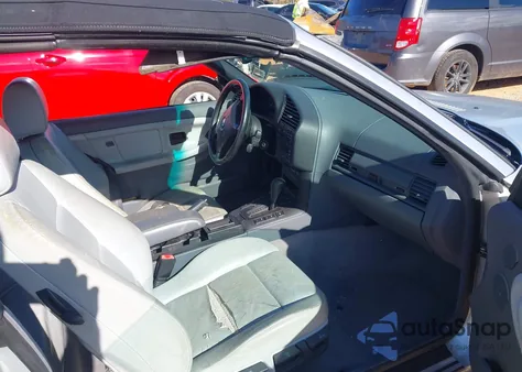 1999 BMW 323Ic z USA, uszkodzony, nr VIN WBABJ8334XEM25144